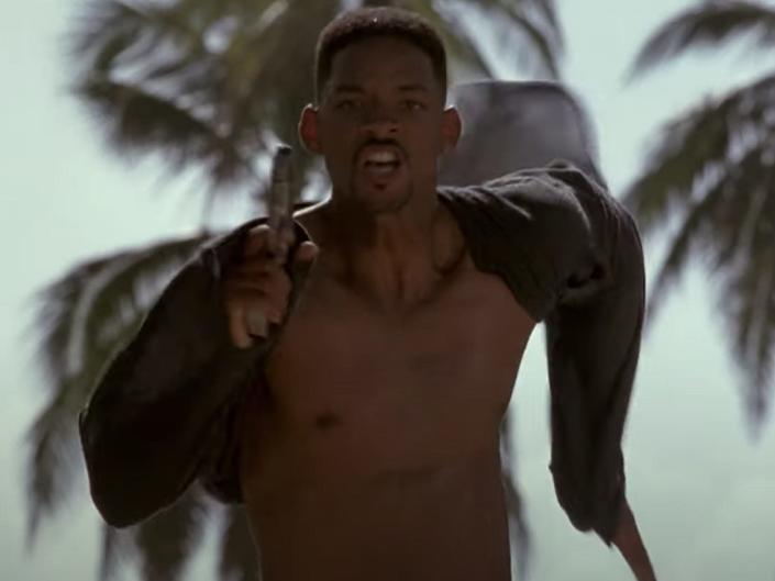 Will Smith running with a gun in 