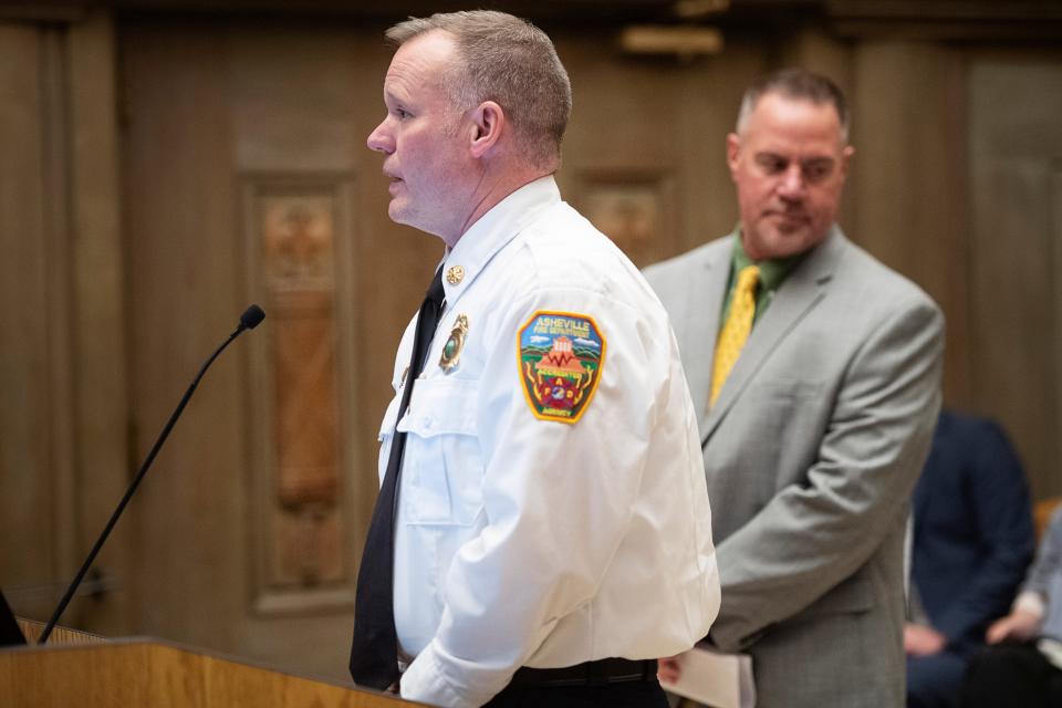 Former Asheville Fire Chief Scott Burnett addresses City Council, January 20, 2023, on the water outages of December 2022. Also pictured is Water Resources Director David Melton, right.