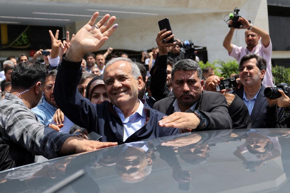 Presidential candidate Masoud Pezeshkian waves to supporters on the day of the presidential election to choose a successor to Ebrahim Raisi following his death in a helicopter crash, in Tehran on June 28, 2024.