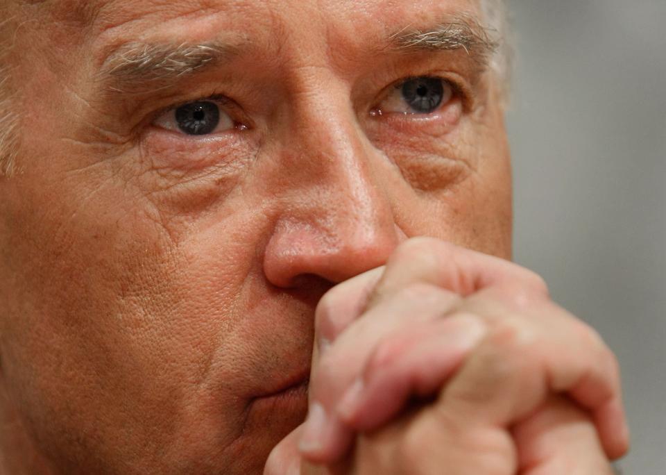 Biden, the chairman of the Senate Foreign Relations Committee, listens to opening remarks from General David Petraeus on Capitol Hill on Sept. 11, 2007, in Washington.