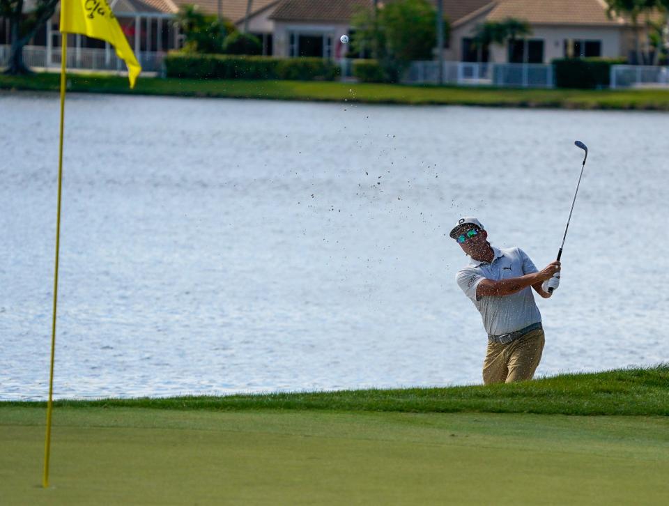 Rickie Fowler hits a bunker shot on the 18th hole during second-round action of the Honda Classic at PGA National in Palm Beach Gardens on Feb. 25.