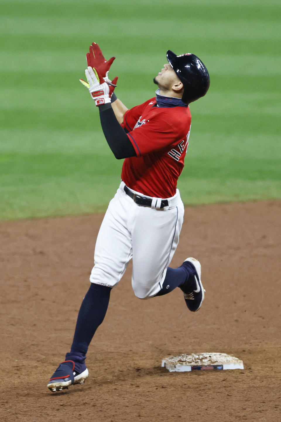 Cleveland Indians' Cesar Hernandez celebrates after hitting a winning single off Pittsburgh Pirates relief pitcher Chris Stratton during the ninth inning of a baseball game, Friday, Sept. 25, 2020, in Cleveland. (AP Photo/Ron Schwane)