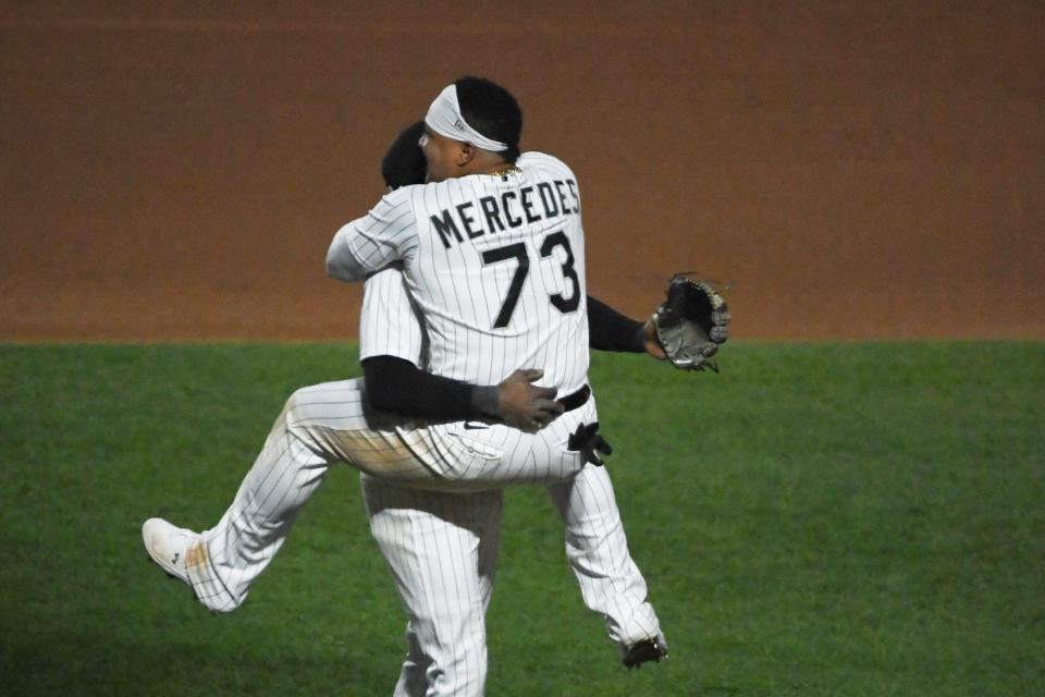 Tim Anderson and Yermin Mercedes celebrate a White Sox win.