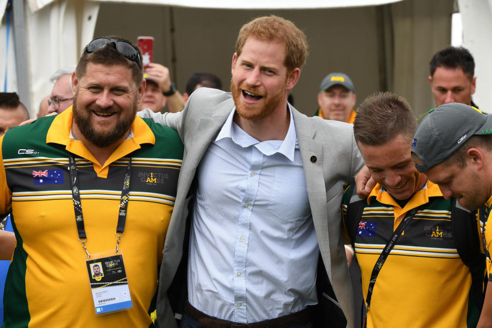 Prince Harry embraces participants in the Invictus Games Sunday morning as wife Meghan Markle took a break. (Photo: James D. Morgan via Getty Images)