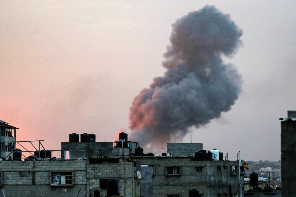 Smoke rises above buildings during an early morning Israeli strike on Rafah in the southern Gaza Strip (AFP via Getty Images)