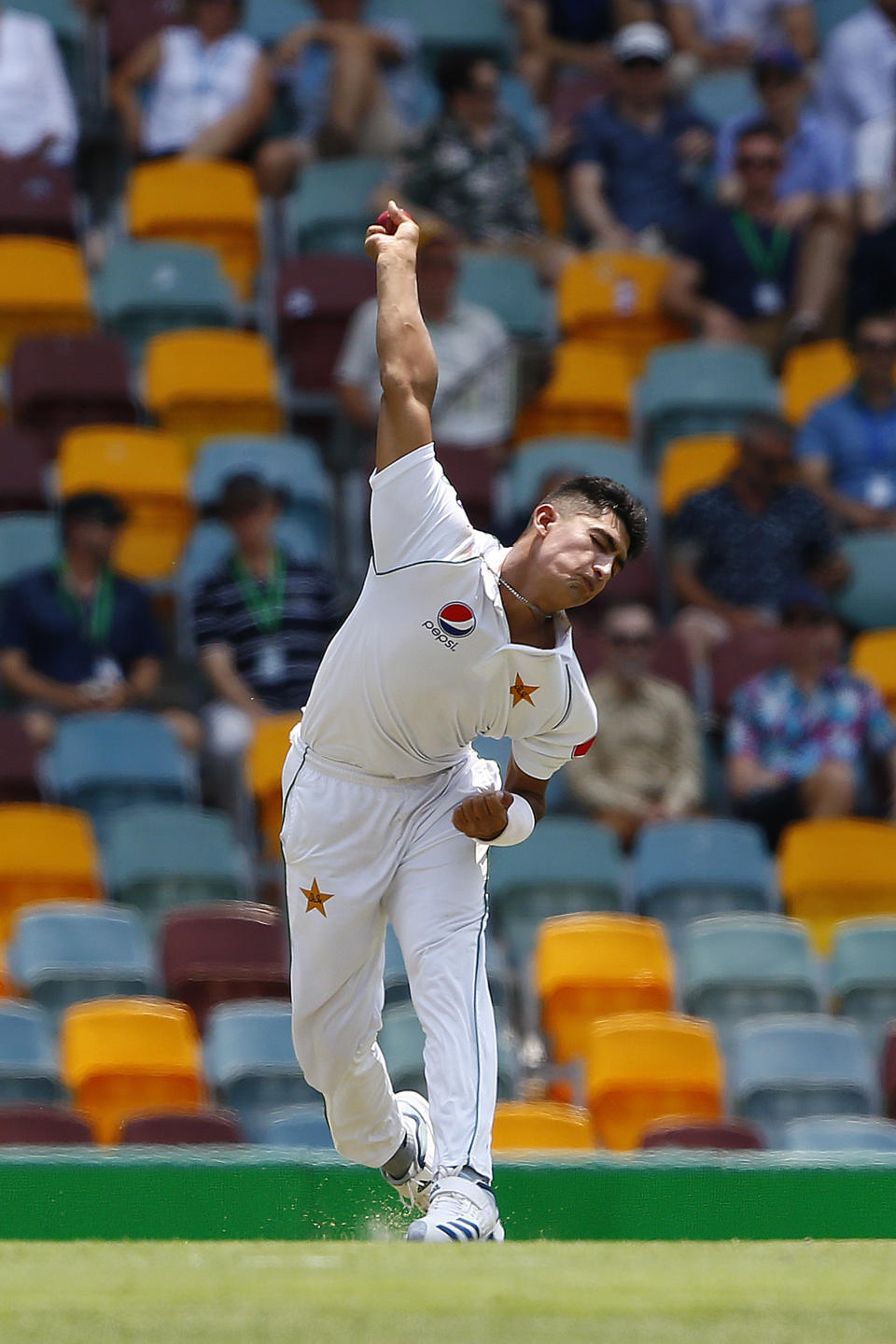 Pakistan's Naseem Shah bowls during their cricket test match against Australia in Brisbane, Australia, Friday, Nov. 22, 2019. (AP Photo/Tertius Pickard)