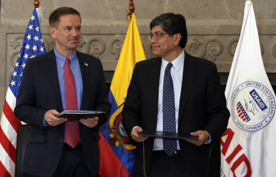 Mark Green, USAID Administrator, and Ecuador's Foreign Minister Jose Valencia, stand during a signing ceremony in Quito, Ecuador, Wednesday, May 15, 2019. USAID returns to Ecuador for the first time since being expelled from the country in 2014 by former President Rafael Correa. (AP Photo/Dolores Ochoa)