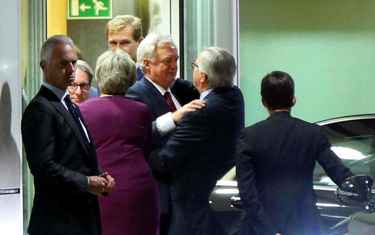 David Davis and Jean-Claude Juncker embrace after dinner in Brussels - 2017 Anadolu Agency