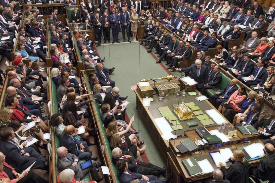 In this handout photo provided by the House of Commons, Britain's Prime Minister Boris Johnson, center right, gestures during his first Prime Minister's Questions, in the House of Commons in London, Wednesday, Sept. 4, 2019. Britain's Parliament is facing a second straight day of political turmoil as lawmakers fought Prime Minister Boris Johnson's plan to deliver Brexit in less than two months, come what may. Johnson is threatening to dissolve the House of Commons and hold a national election that he hopes might produce a less fractious crop of legislators. (Jessica Taylor/House of Commons via AP)
