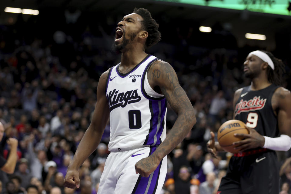 Sacramento Kings guard Malik Monk (0) celebrates after scoring against the Portland Trail Blazers during the second half of an NBA basketball game in Sacramento, Calif, Wednesday, Nov. 8, 2023. (AP Photo/Jed Jacobsohn)