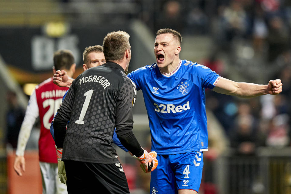 BRAGA, PORTUGAL - FEBRUARY 26: George Edmundson and Allan McGregor of Rangers FC celebrate the victory at the end of the UEFA Europa League round of 32 second leg match between Sporting Club Braga and Rangers FC at Estadio Municipal de Braga on February 26, 2020 in Braga, Portugal. (Photo by Jose Manuel Alvarez/Quality Sport Images/Getty Images)