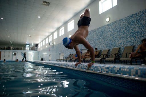 Afghan amputee Malek Mohammad trains in a swimming pool in Kabul on April 13, 2012. The 18-year-old, whose legs were blown off by a Soviet landmine, dreams of swimming for Afghanistan in the London Paralympics