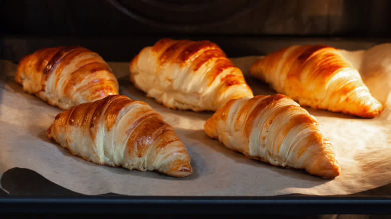 croissants on baking sheet in oven