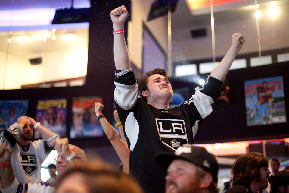 LOS ANGELES, CA - JUNE 11: Fans celebrate a goal scored by the Los Angeles Kings during Game 6 of the 2012 Stanley Cup Final June 11, 2012 in Los Angeles, California. A win in Game 6 against the New Jersey Devils would lead the Los Angeles Kings to their first championship in franchise history. (Photo by Jonathan Gibby/Getty Images)