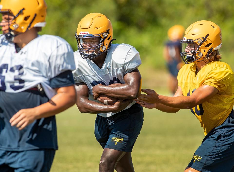 Warner University #30 RB Clyde Holland runs with the ball during Royals Football practice in Lake Wales Fl. Friday August 20 2021.  ERNST PETERS/ THE LEDGER