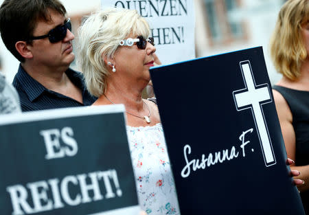 People hold placards during a demonstration called out by the Anti-immigration party Alternative for Germany (AfD) in Mainz, Germany, June 9, 2018, after a 20-year-old Iraqi man had admitted to the rape and murder of Susanna F., a 14-year-old German girl. Placards read "Enough, finally draw the consequences". REUTERS/Ralph Orlowski