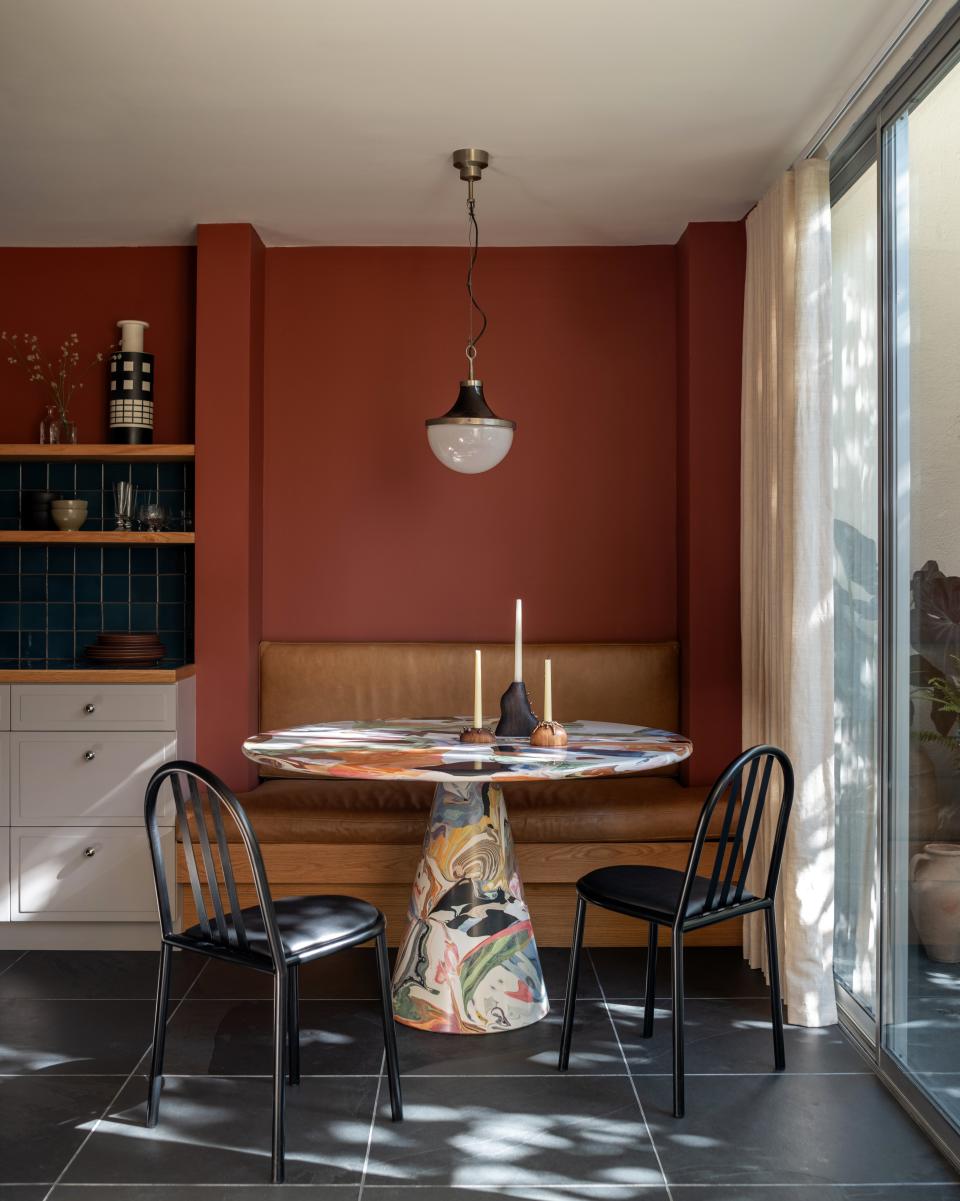 You’d never know that the Dirk Van Der Kooij table in the breakfast nook was made of recycled plastic. The vintage Robert Mallet-Stevens chairs around it cut a Stygian contrast to the Sergio Mazza pendant above. The candle holders are by contemporary artist James Naish and were sourced from Rhett Baruch Gallery.