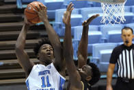 North Carolina forward Day'Ron Sharpe (11) shoots over College of Charleston center Osinachi Smart (33) during the first half of an NCAA college basketball game in Chapel Hill, N.C., Wednesday, Nov. 25, 2020. (AP Photo/Gerry Broome)