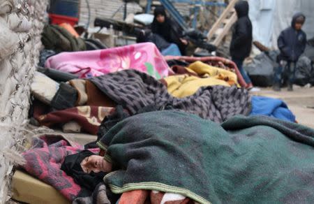 Sick people wait to be evacuated from a rebel-held sector of eastern Aleppo, Syria December 16, 2016. REUTERS/Abdalrhman Ismail