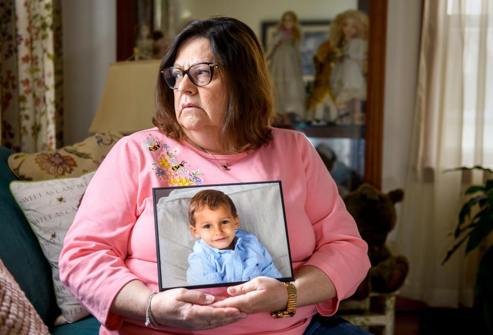 Laura Walker of Washington holds a photo of her grandson Navin Jones, 8, who was found dead March 29 in his parents' Peoria home.