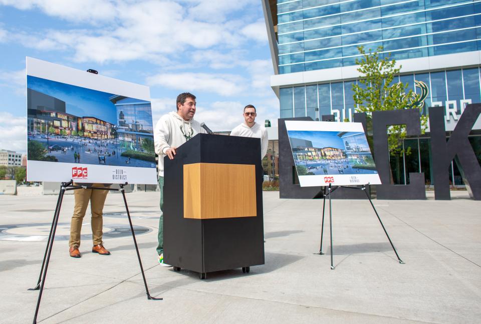 Peter Feigin, president of the Milwaukee Bucks and Fiserv Forum, alongside Bucks player Pat Connaughton, right, discusses the proposal for a two-room concert venue complex in Milwaukee's Deer District outside Fiserv Forum in Milwaukee on Monday, May 23, 2022. FPC Live announced Monday it plans to develop the facility on the northeast section of the former Bradley Center site.