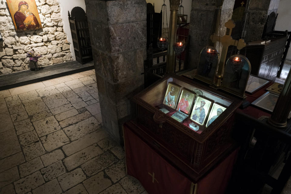 In this Wednesday, April 8, 2020 photo, the Old Orthodox Church in Sarajevo, Bosnia, is deserted due to the national lockdown the authorities have imposed attempting to limit the spread of the new coronavirus. (AP Photo/Kemal Softic)