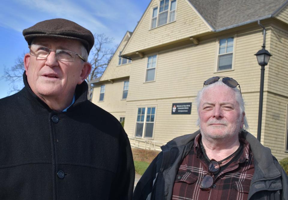 Robert Hoatson and Richard Eldridge talk about abuse by clergy in front of the Diocese of Fall River office in Fall River.