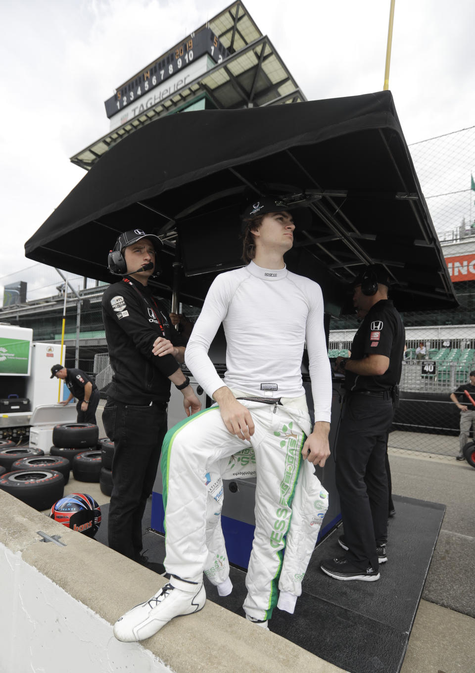 In this Tuesday, May 14, 2019 photo, driver Colton Herta, left, and George Steinbrenner IV watch during practice for the Indianapolis 500 IndyCar auto race at Indianapolis Motor Speedway in Indianapolis. The 22-year-old Steinbrenner is part owner of Harding Steinbrenner Racing team. Their driver, Colton Herta, will start fifth in Sunday’s Indianapolis 500. (AP Photo/Darron Cummings)