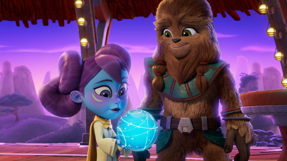 STAR WARS: YOUNG JEDI ADVENTURES – (L-R): Lys Solay admires Johgeshakka’s family Life Day Orb