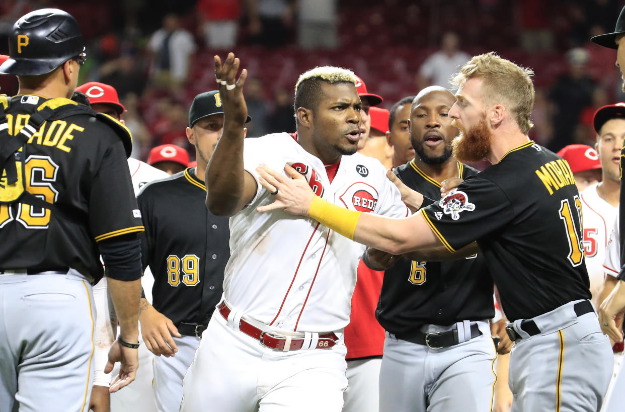 Yasiel Puig's last at as a member of the Reds involved jumping into a brawl against the Pirates after he had been traded. (Getty)