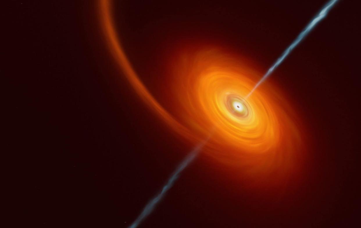Artist's impression of a star being squeezed by the intense gravitational pull of a black hole - ESO/M Kornmesser/PA