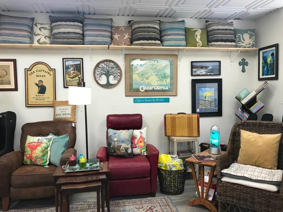 Comfy chairs, pillows and art are among the treasures waiting for people to buy them at the new Thrift by the Sea shop in Cambria.