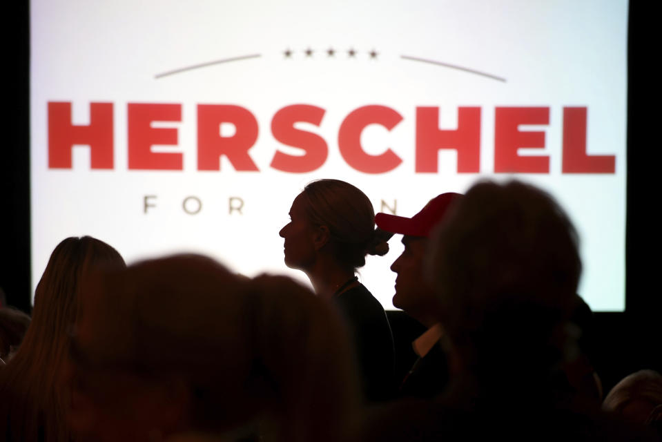 Supports wait for Herschel Walker to speak after his Republican Primary win on Tuesday, May 24, 2022, at the Georgian Terrace Hotel in Atlanta. Walker would face U.S. Sen. Raphael Warnock, a Democrat, in November. (Jason Getz/Atlanta Journal-Constitution via AP)