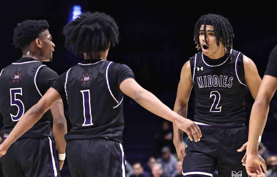 Middletown's Jeremiah Landers (2) reacts with his teammates Michael Maldonado and Chancellor Knight Jr. (5) during their district final against Centerville Sunday, March 10, 2024.