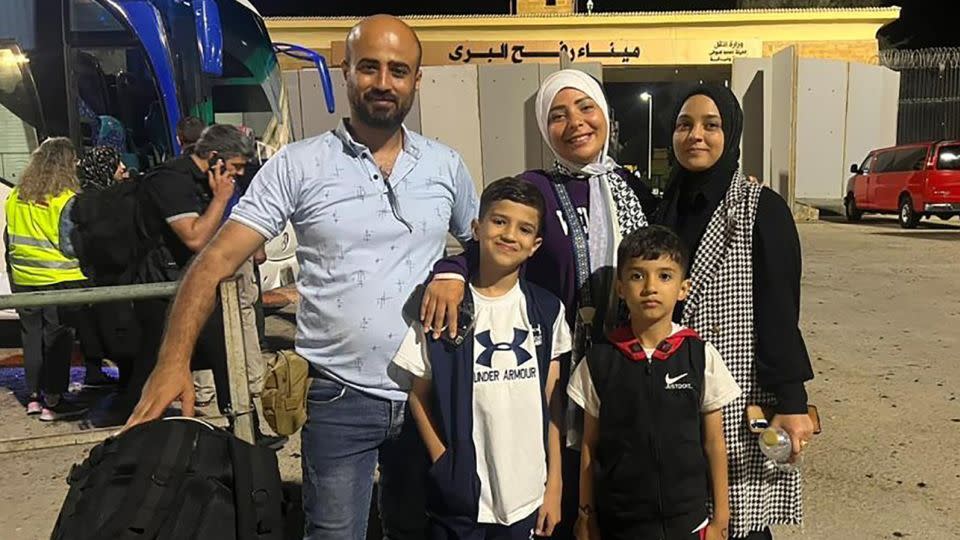 CNN producer is pictured with his wife, two boys and CNN journalist Asmaa Khalil after crossing into Egypt from Gaza, in Rafah, Egypt on November 3. - Ibrahim Dahman/CNN