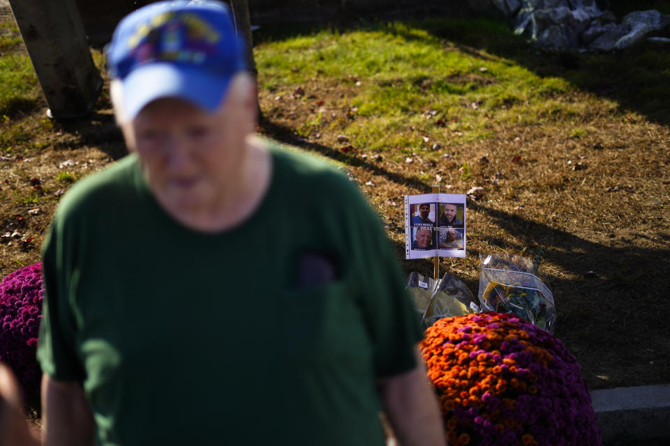 Bill Brackett, who's son Billy was killed at the mass shooting at Schemengees Bar and Grille speaks during an interview in front of a makeshift memorial in Lewiston, Maine, Saturday, Oct. 28, 2023. (AP Photo/Matt Rourke)