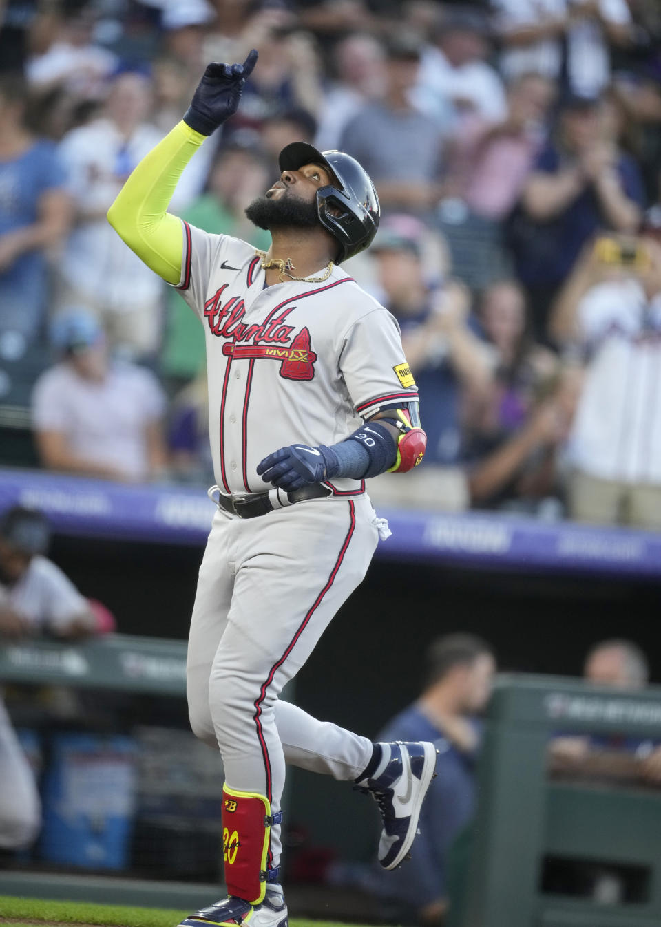 Atlanta Braves' Marcell Ozuna gestures as he runs the bases on a solo home run off Colorado Rockies starting pitcher Peter Lambert during the second inning of a baseball game Tuesday, Aug. 29, 2023, in Denver. (AP Photo/David Zalubowski)