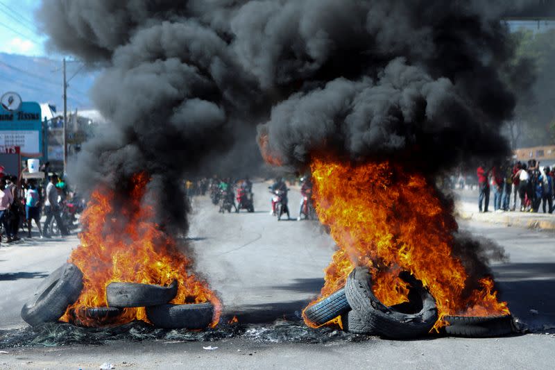 Haitians demand higher wages in protest where journalist is killed, in Port-au-Prince