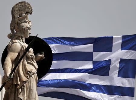 A Greek national flag flutters next to a statue of ancient Greek goddess Athena, in Athens May 21, 2015. REUTERS/Alkis Konstantinidis