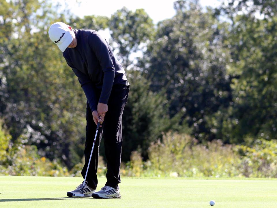 John Glenn's Noah Dever hits a putt during the Muskingum Valley League Tournament on Friday at Zanesville Jaycees. Dolan shot 82 as the Muskies won their eighth league title in 10 years. 