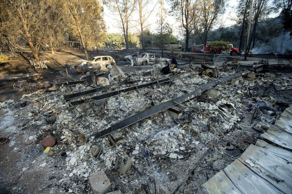 Wind-driven wildfires threatened homes in Northern California