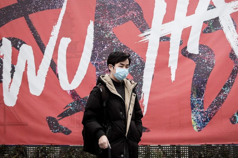 A man wears a mask while walking on Jan. 22 in Wuhan, Hubei province, China | Getty