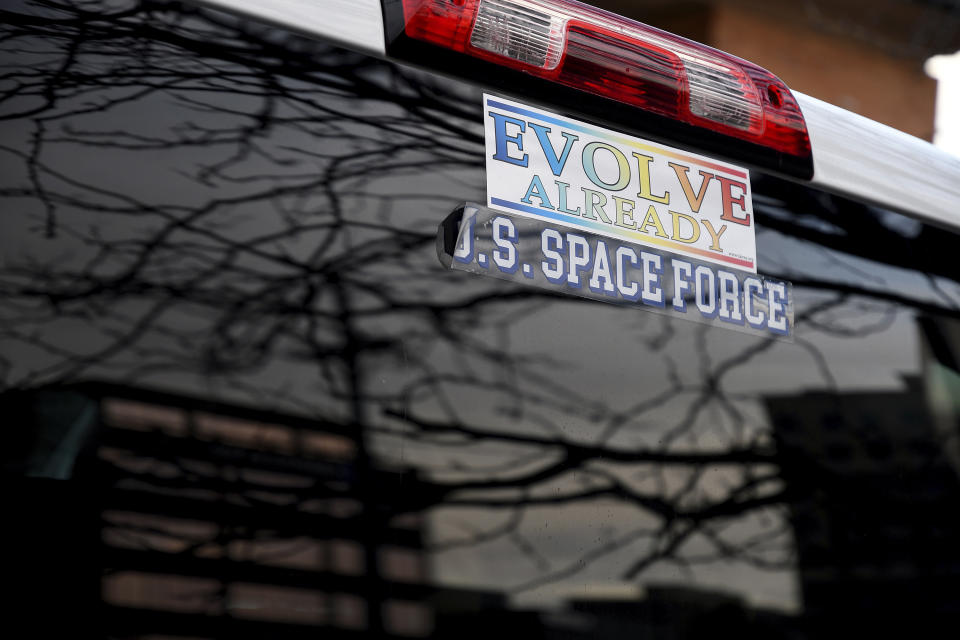 Bumper stickers on a pickup in downtown Colorado Springs, Colo., on Wednesday, Nov. 23, 2022. (AP Photo/Thomas Peipert)