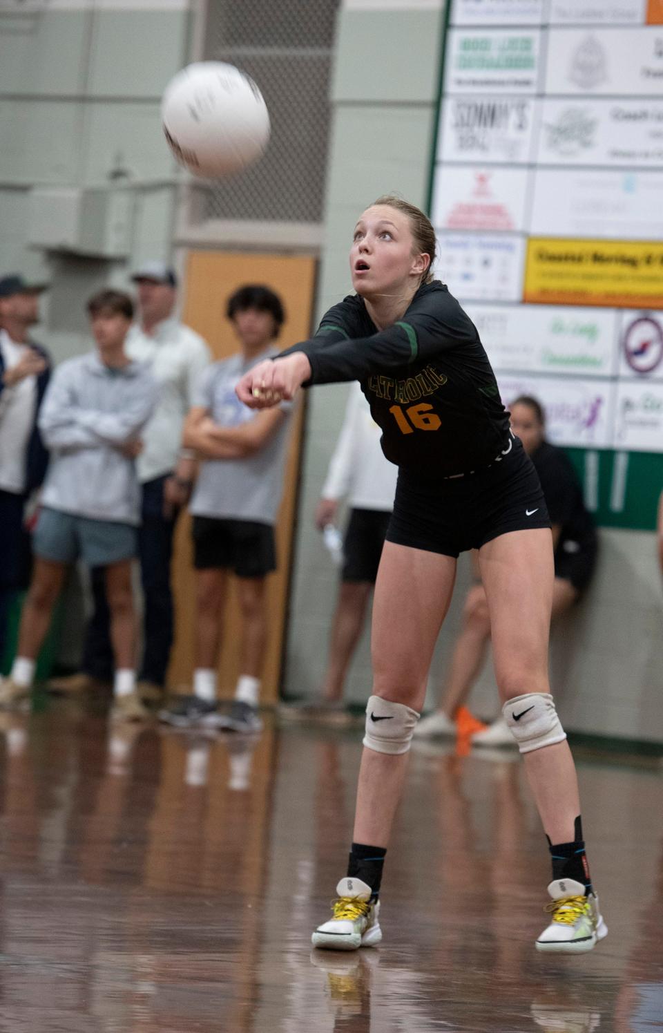 Catholic HIgh's Mallory Zettler (No. 16) digs a Gulf Breeze serve during match play Thursday, Sept. 29, 2022. Gulf Breeze defeated Catholics 25-16,25-16, 25-17.