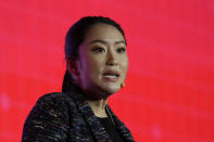 The daughter of Thailand's former Prime Minister Thaksin Shinawatra, Paetongtarn Shinawatra cheers with supporters during a Pheu Thai party general assembly meeting in Bangkok, Thailand, Tuesday, Dec. 6, 2022. Shinawatra promised a new era of social equality Tuesday, saying if her party is elected to power in next year's election it will bring an end to poverty in the Southeast Asian nation. (AP Photo/Sakchai Lalit)