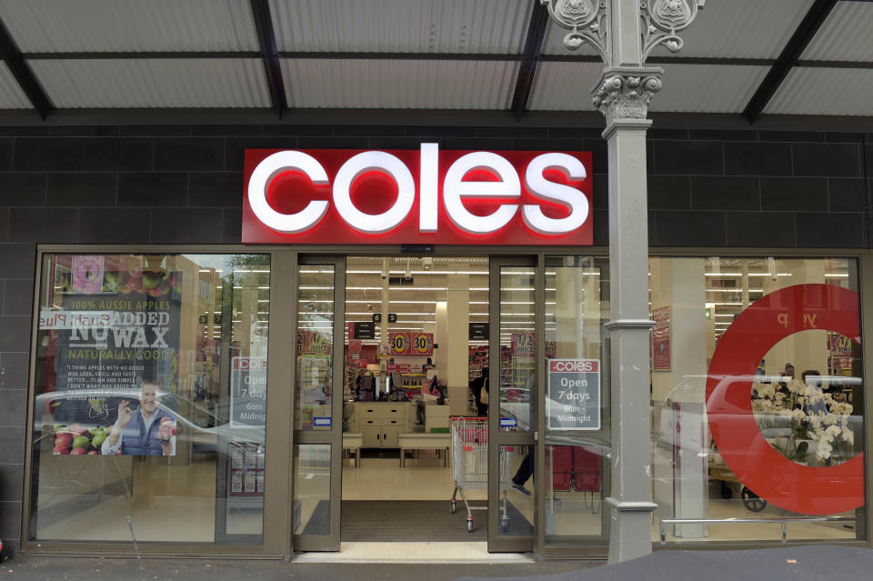 Signage for a Coles supermarket is displayed at the entrance to a store in the Richmond area of Melbourne.