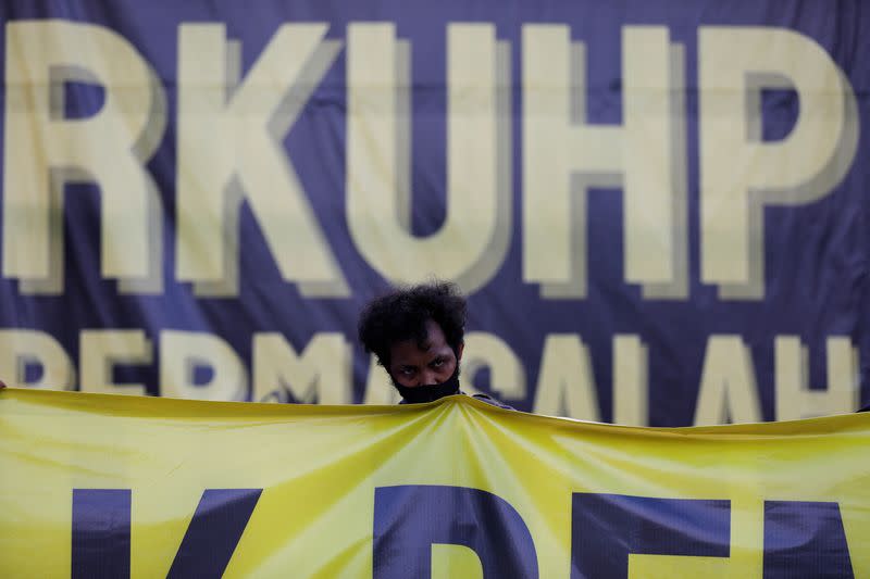 People protest against a new criminal code in Jakarta