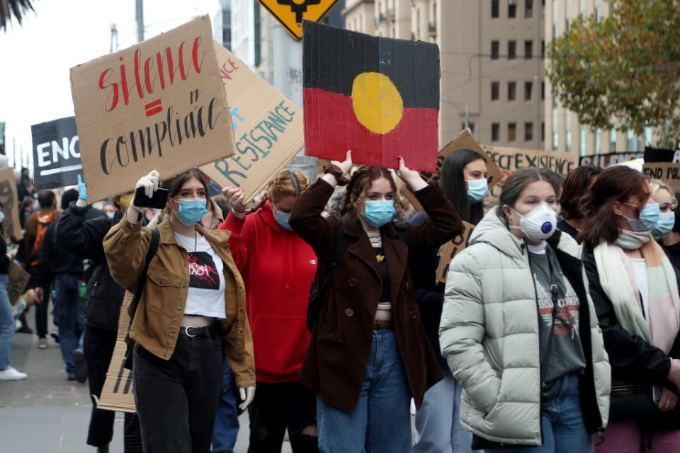 Protesters holding up signs on Bourke Street during the protest on 06 June, 2020 in Melbourne, Australia.