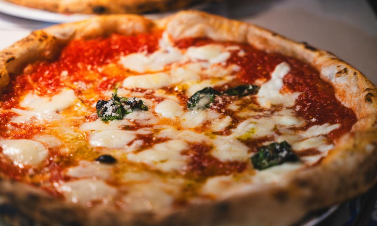 <span>Some brands are offering simpler pizzas inspired by Italian styles – though others have launched a cheeseburger pizza and a carbonara flavouring topped with pasta.</span><span>Photograph: Francesco Riccardo Iacomino/Getty Images</span>