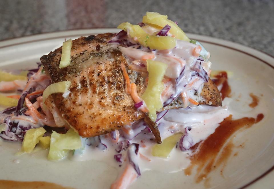 Pop's Hawaiian Salmon with coleslaw, pineapple and a barbecue drizzle.